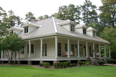 beige house with gray metal roofing|beige house with metal roof.